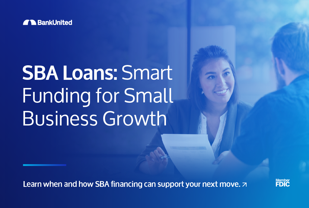 Women smiling at man holding documents