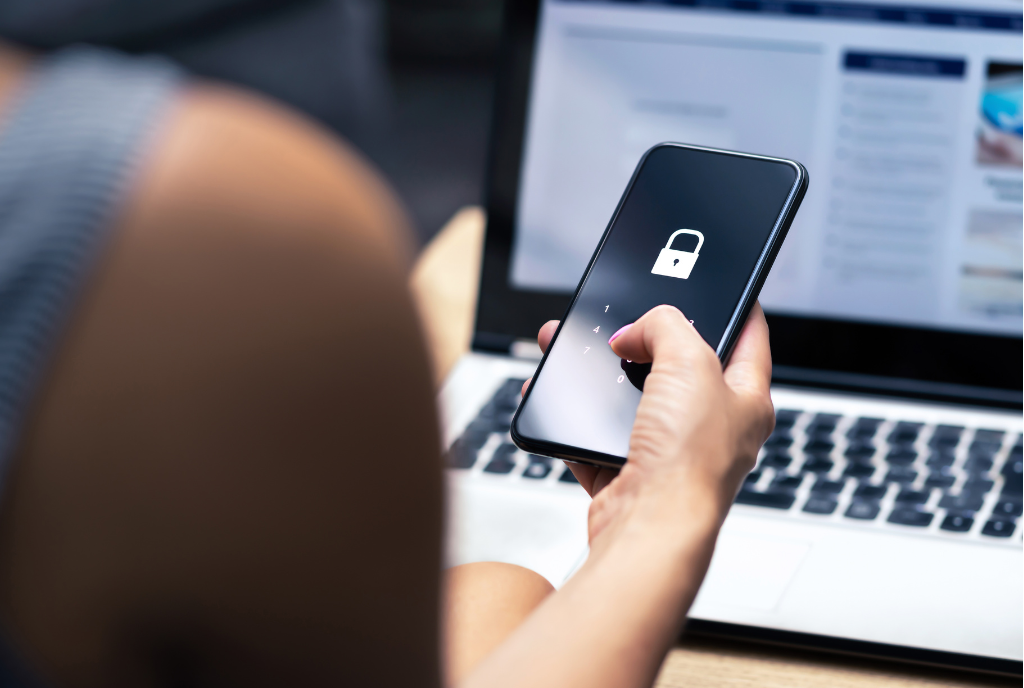 woman holding phone with lock screen