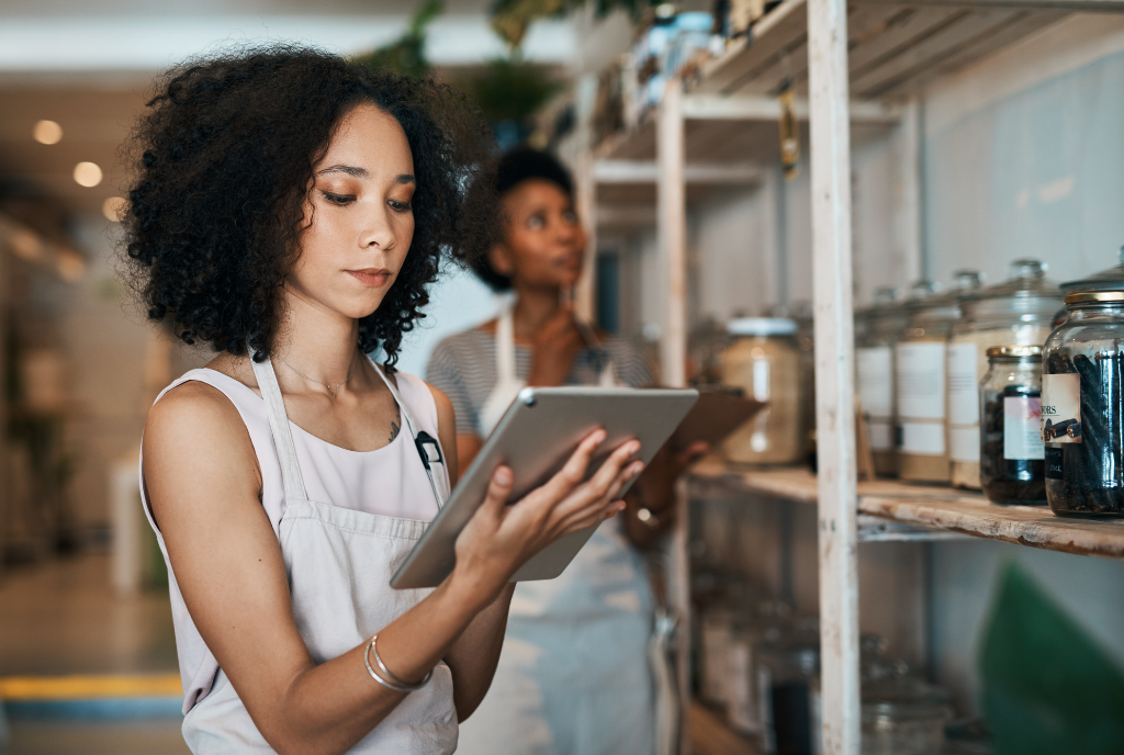 Woman holding a tablet in a shop