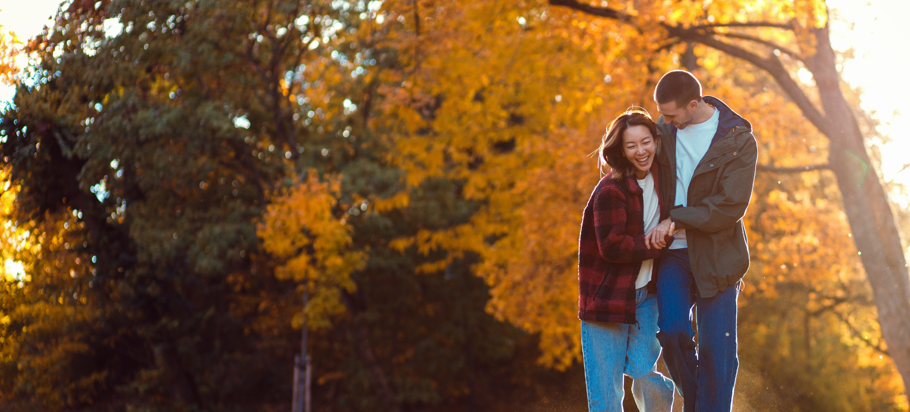 Couple holding each other laughing