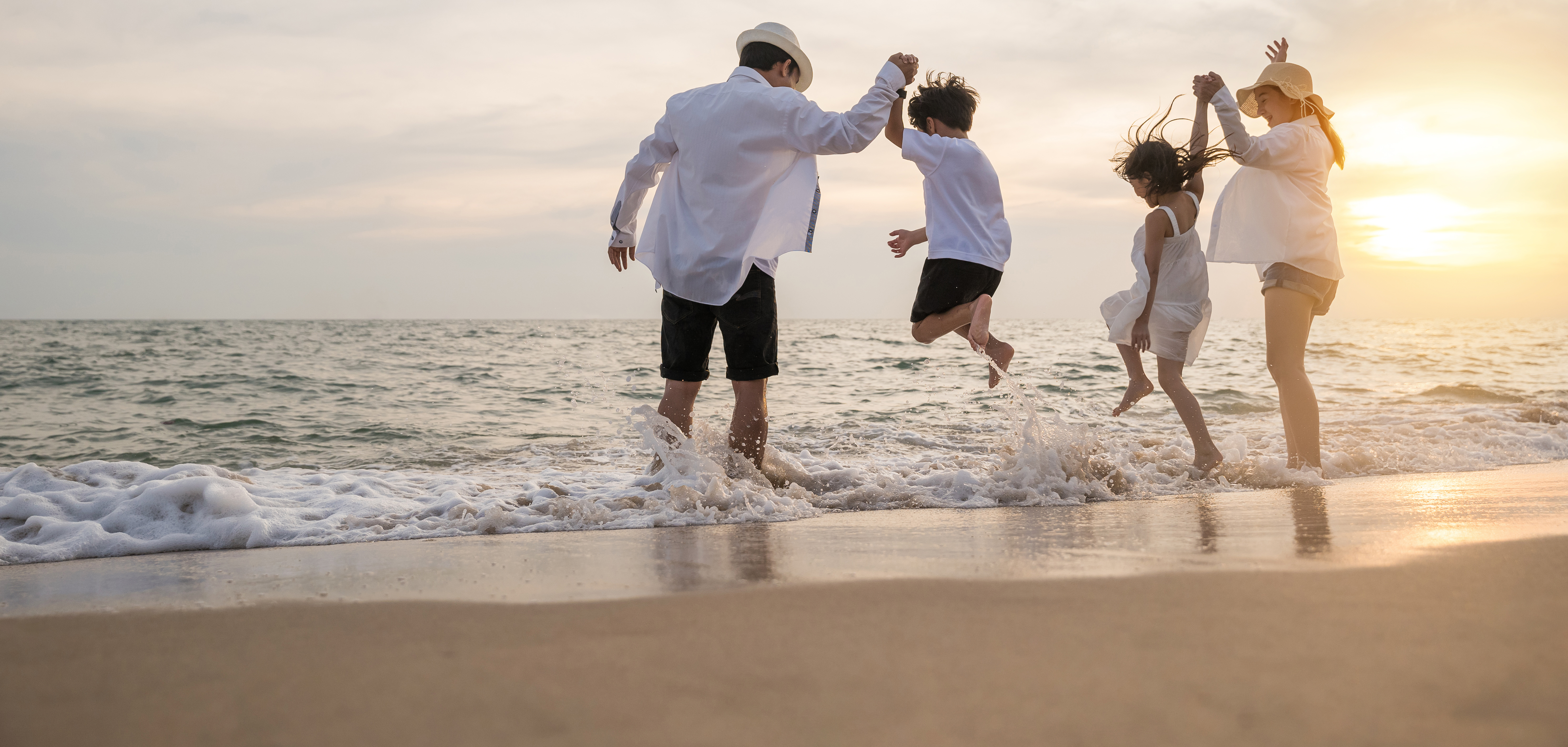 Family playing on the beach