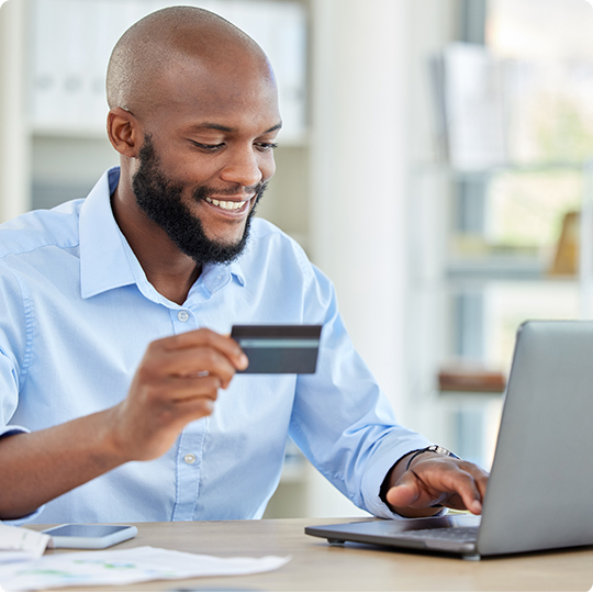 Business man using card to pay for expenses online