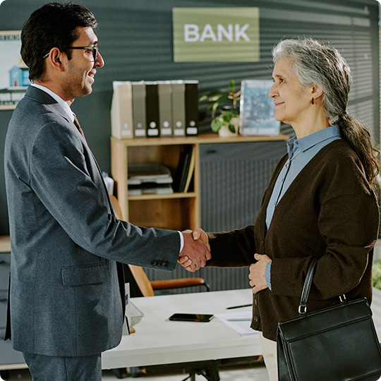 banker and client shaking hands