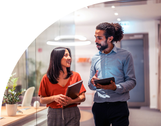 Man and a woman talking in a business setting