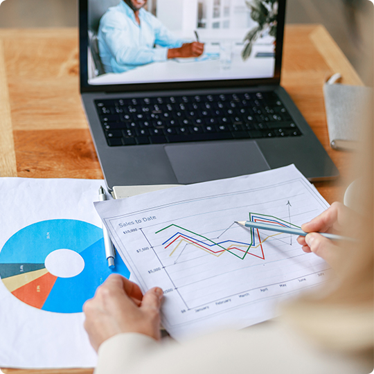 person looking over reports