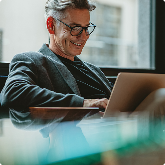 man smiling on tablet