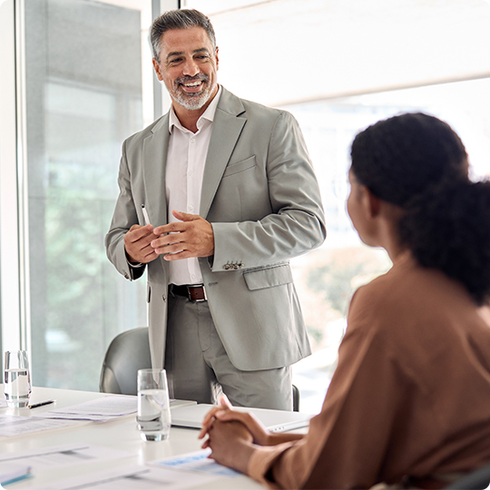 Business man speaking to colleague