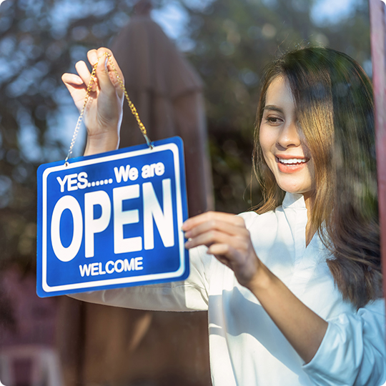 Small Business Owner Holding Open Sign