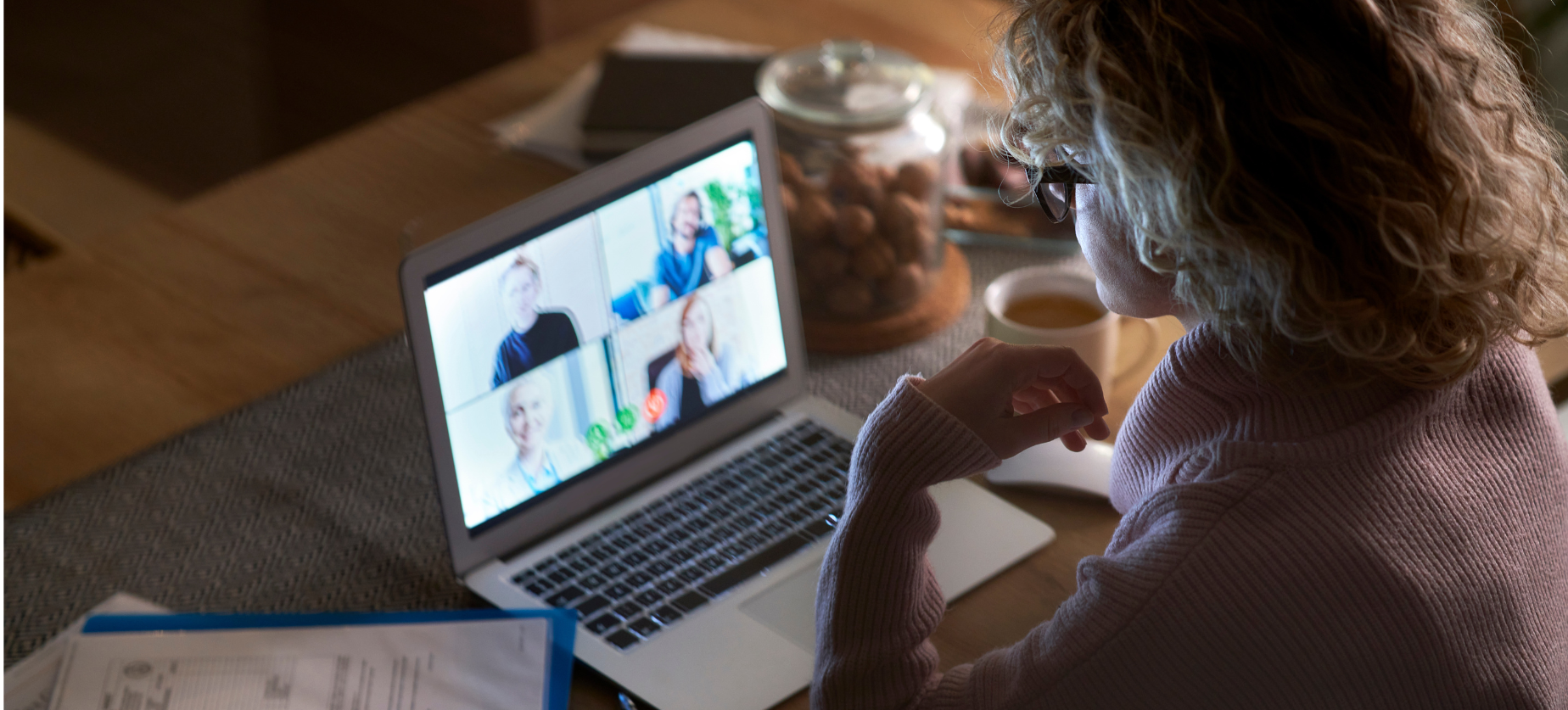 woman on laptop listening to webinar