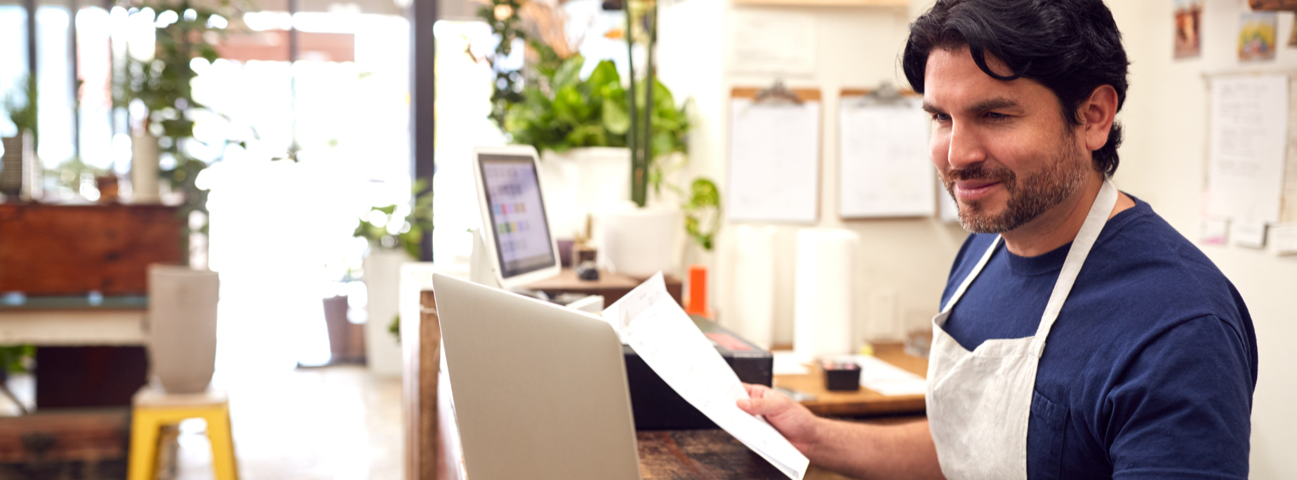 Male business owner on computer