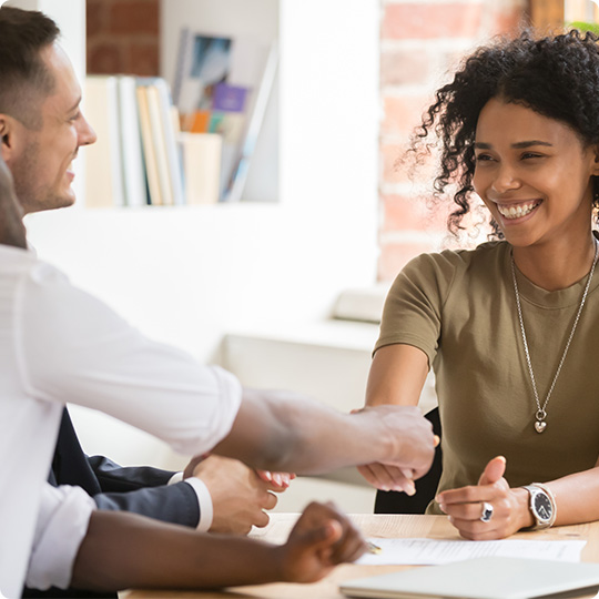 Woman shaking hands with the banker