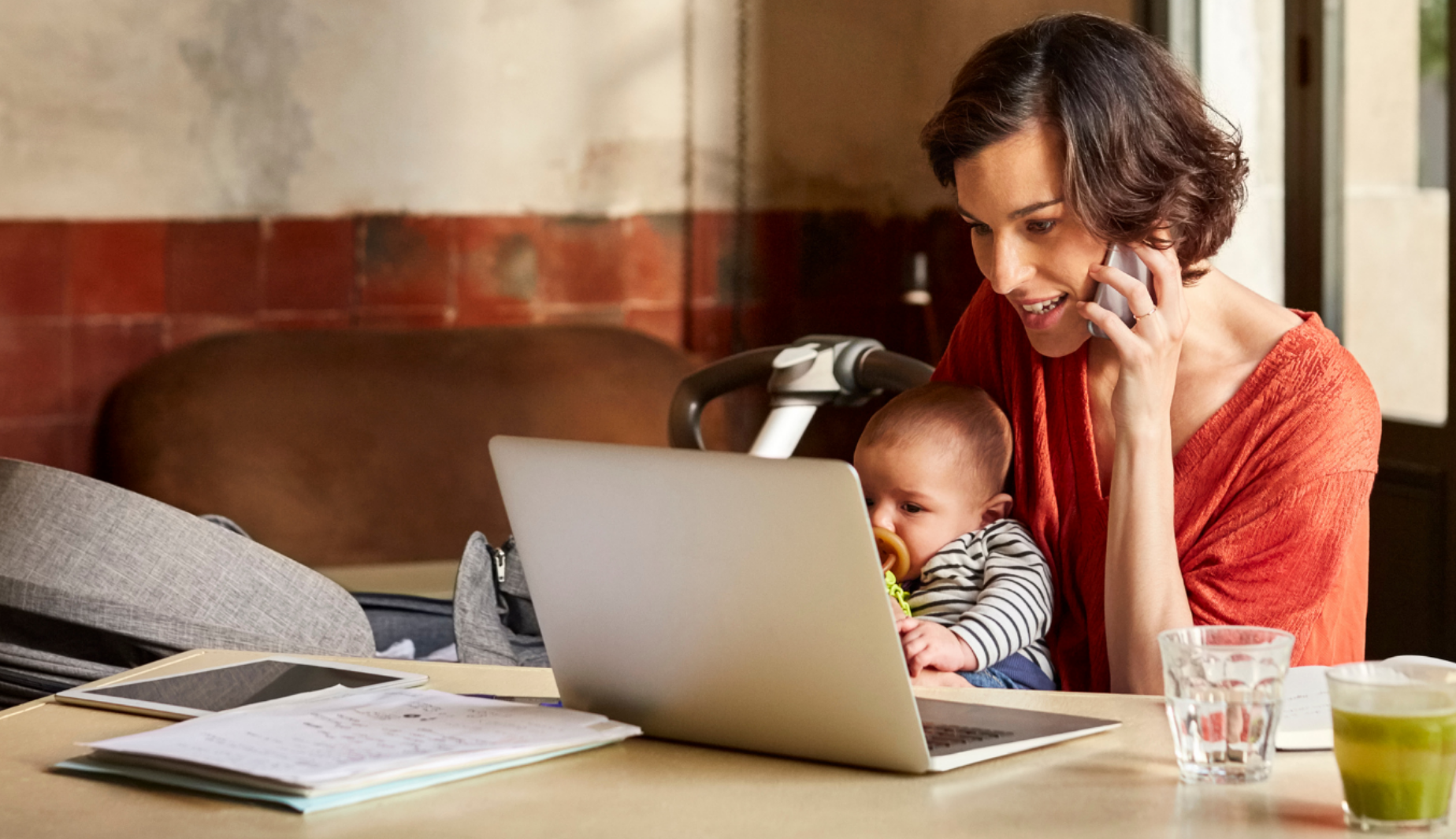Woman on Phone and Computer with Baby