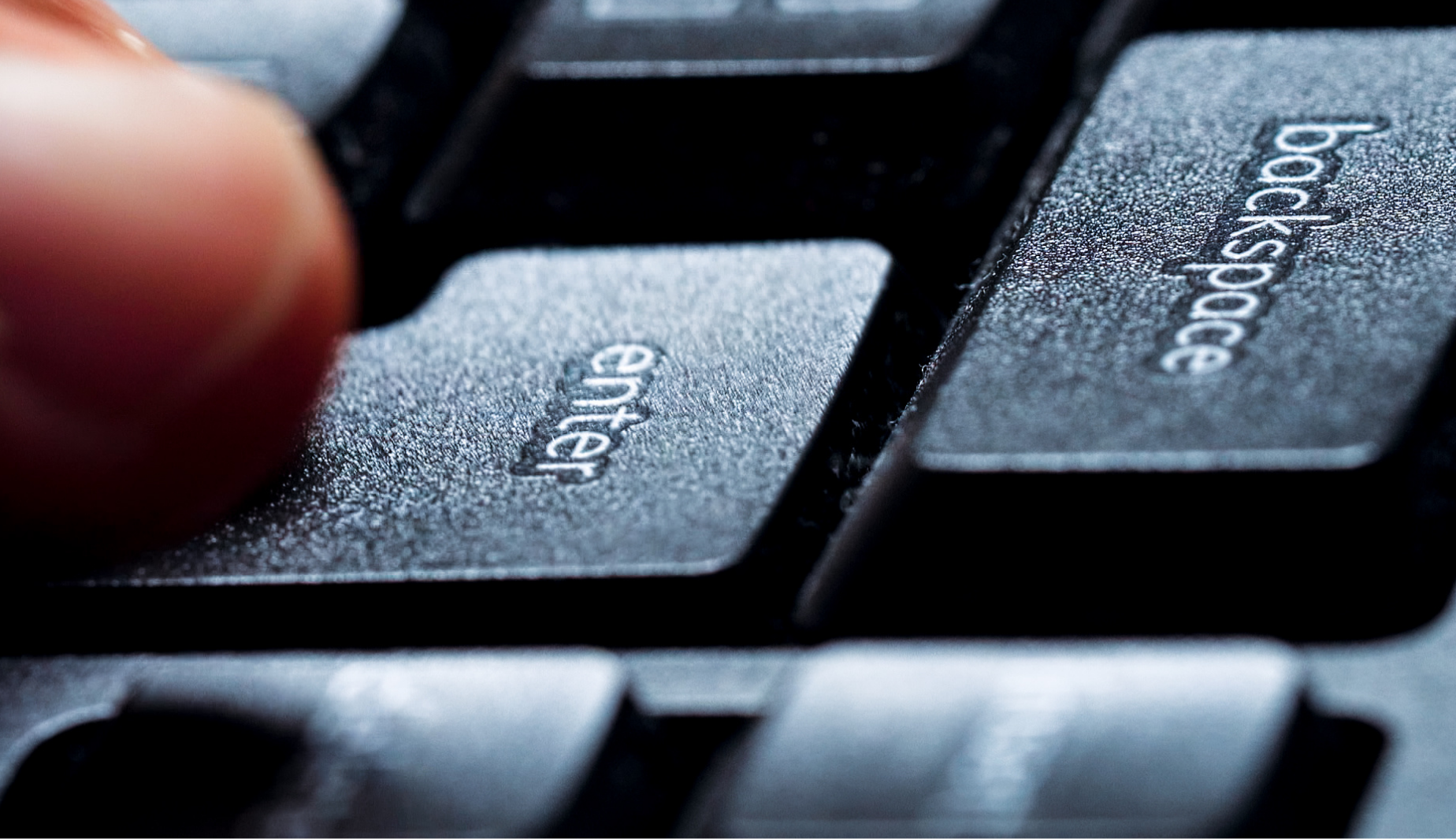 Hand typing on computer keyboard