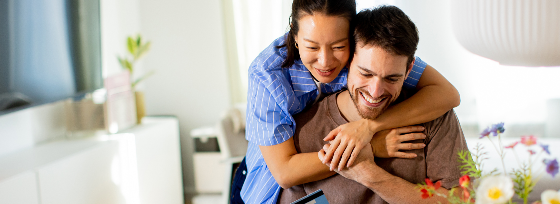 Couple on computer smiling