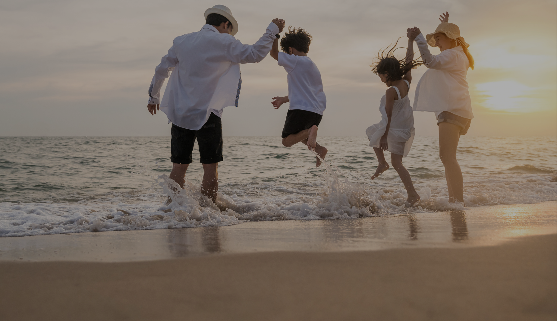 Family playing on the beach