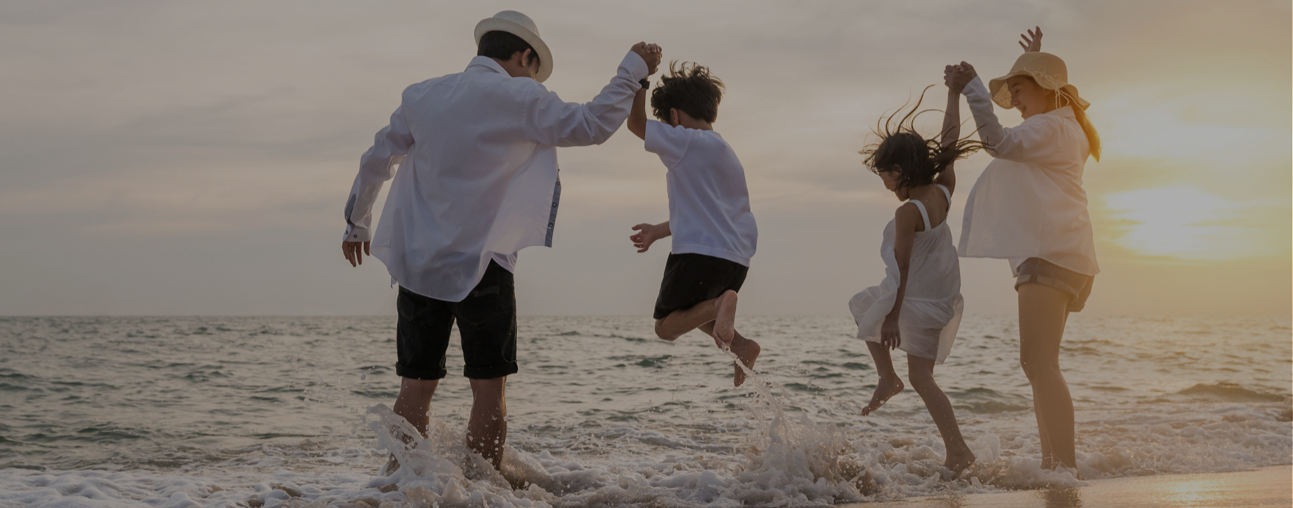 Family playing on the beach
