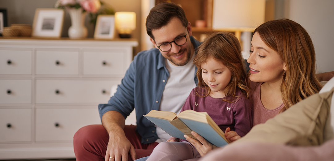 family reading a book