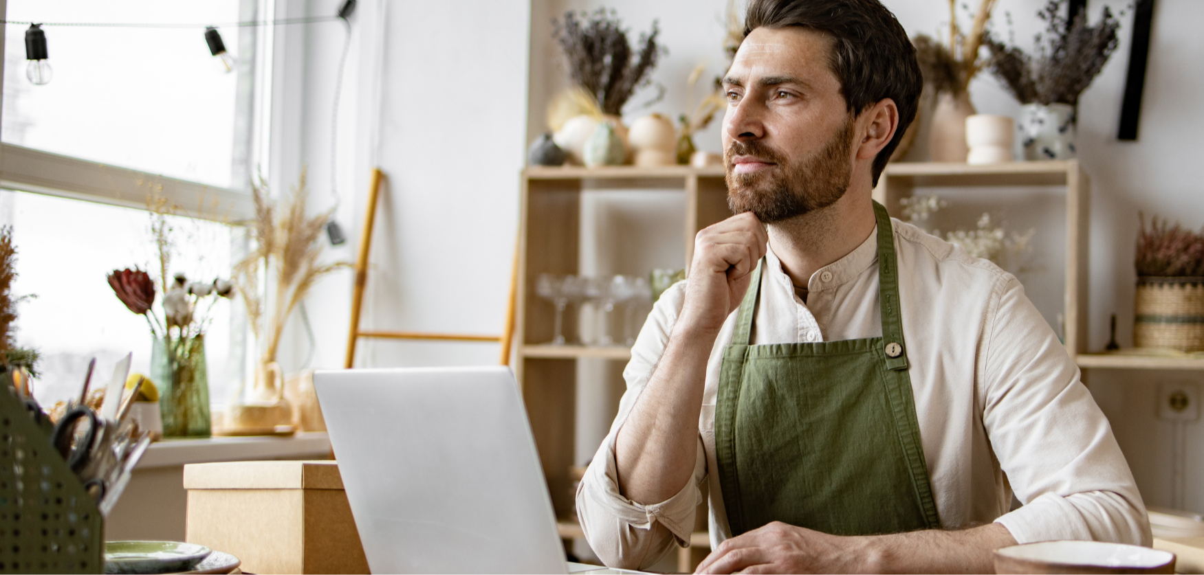 male small business owner with laptop